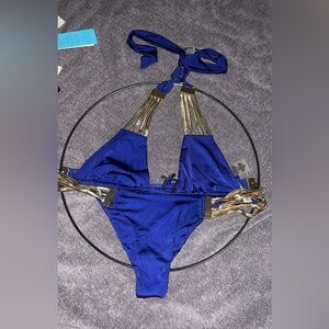 NWOT never worn . Beach Bunny Bikini “Take the Reins” size medium. Blue & Gold